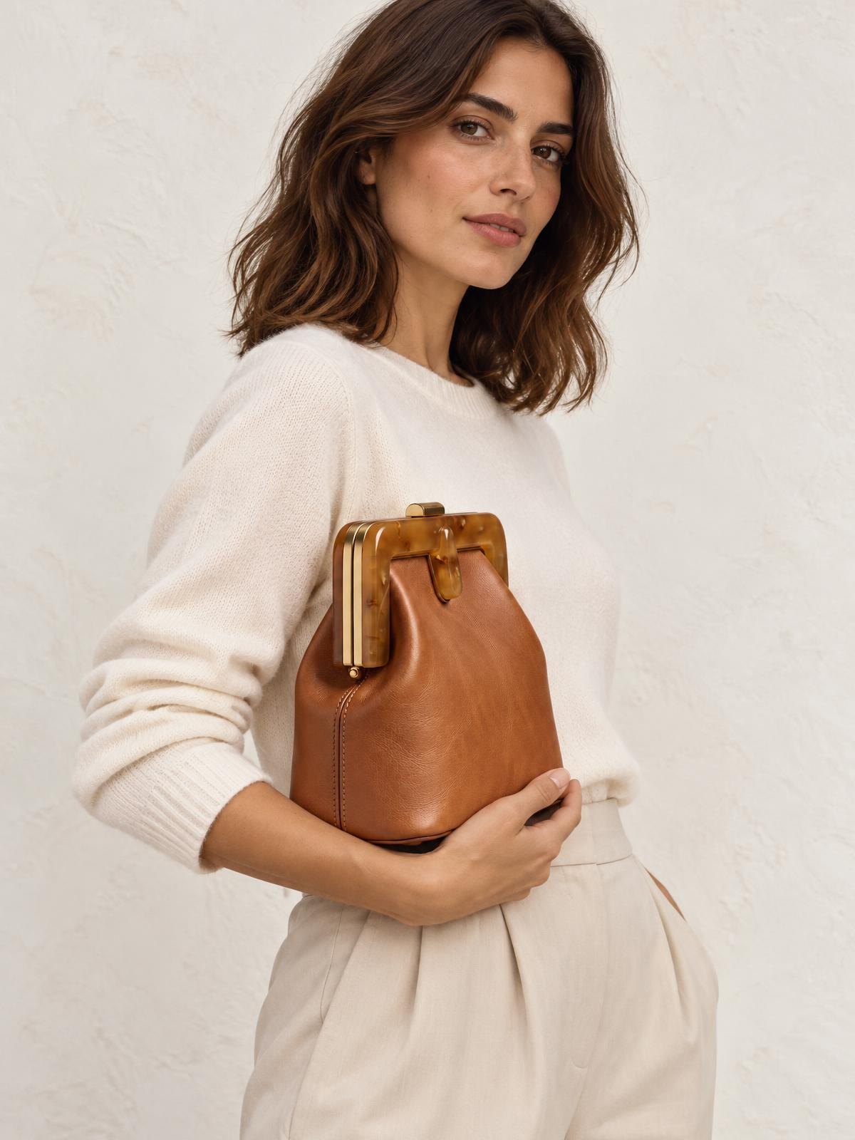 Objet Vide Cast Resin Clutch — worn by a model