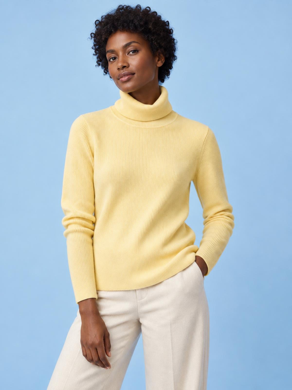 Aurelia Nord Fine Rib Roll Neck in butter yellow worn by a model