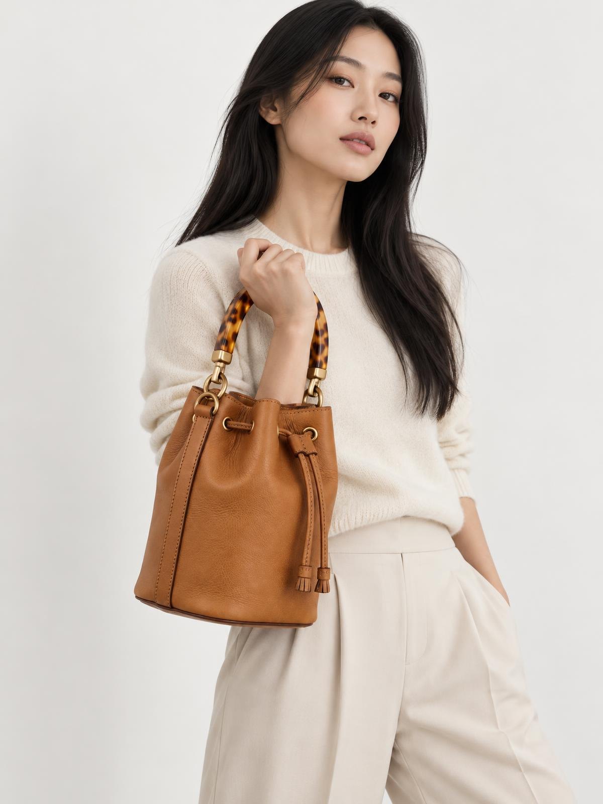 Objet Vide Resin Handle Bucket Bag — worn by a model