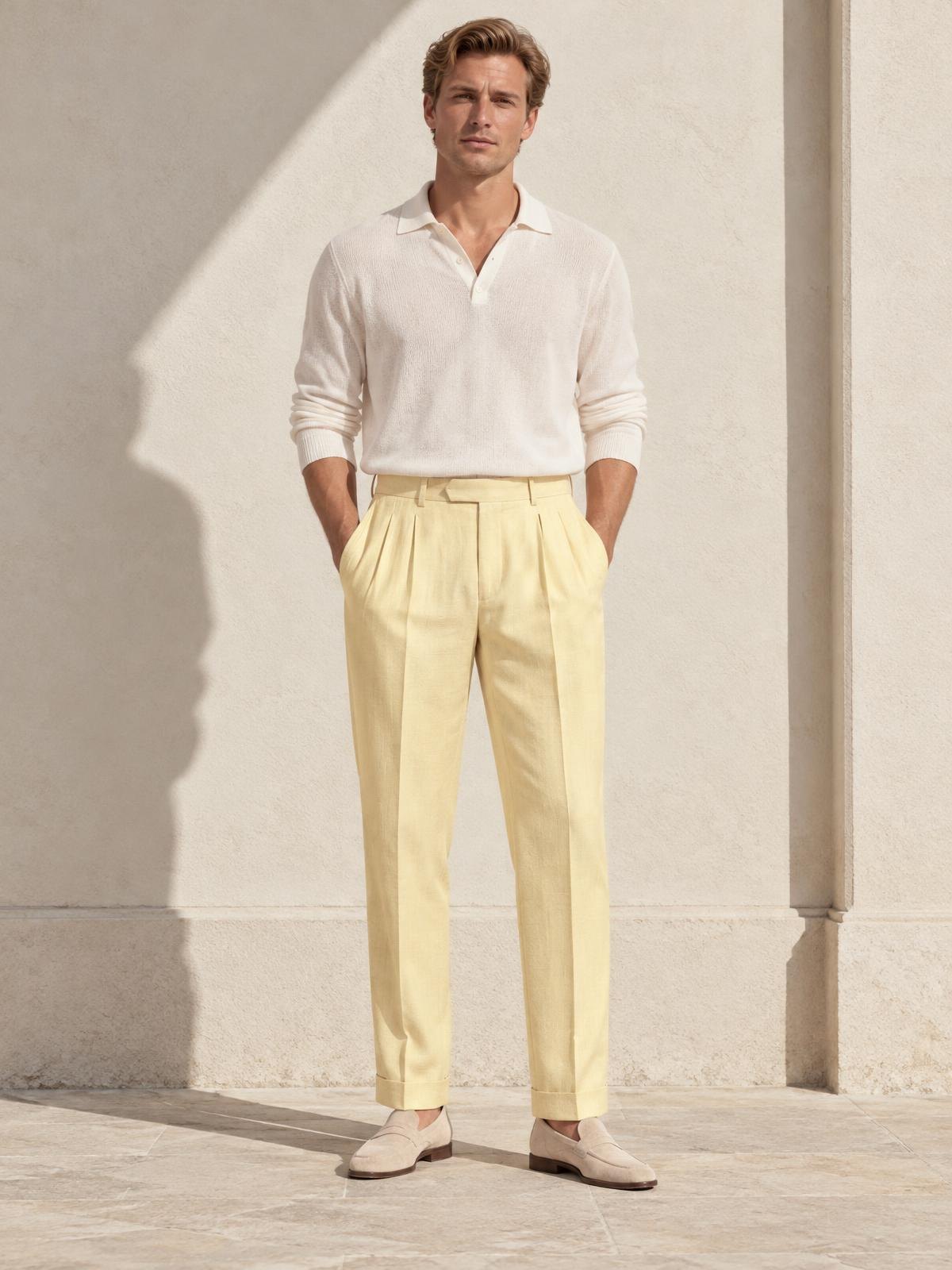 Casa Ferrante Pleated Wool Trouser in butter yellow worn by a model
