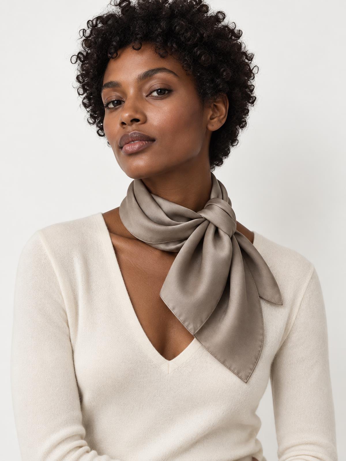 North Vessel Chunky Wool Scarf in ecru — worn by a model