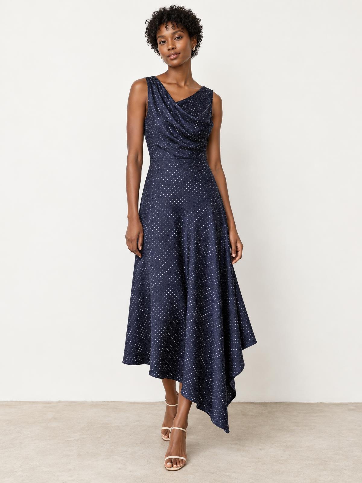 Lune Boreale Asymmetric Wool Dress in navy micro dot worn by a model