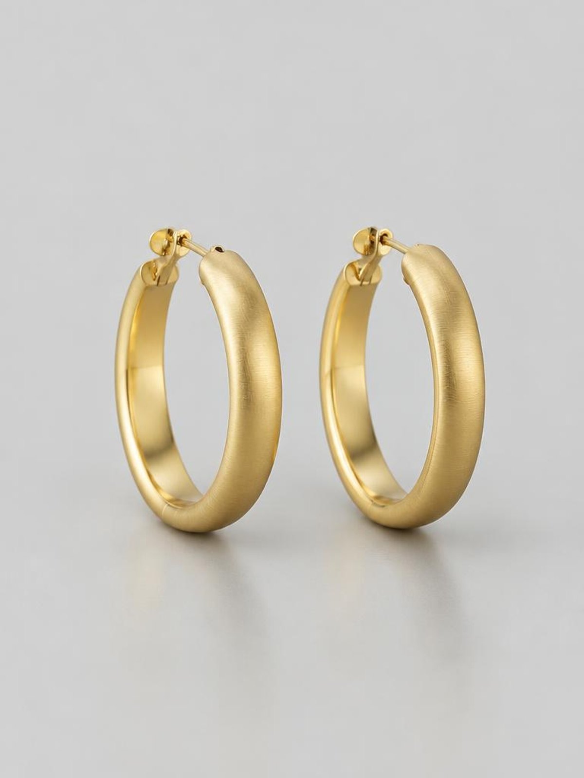 Atelier Verrine Brushed Gold Hoop — worn by a model