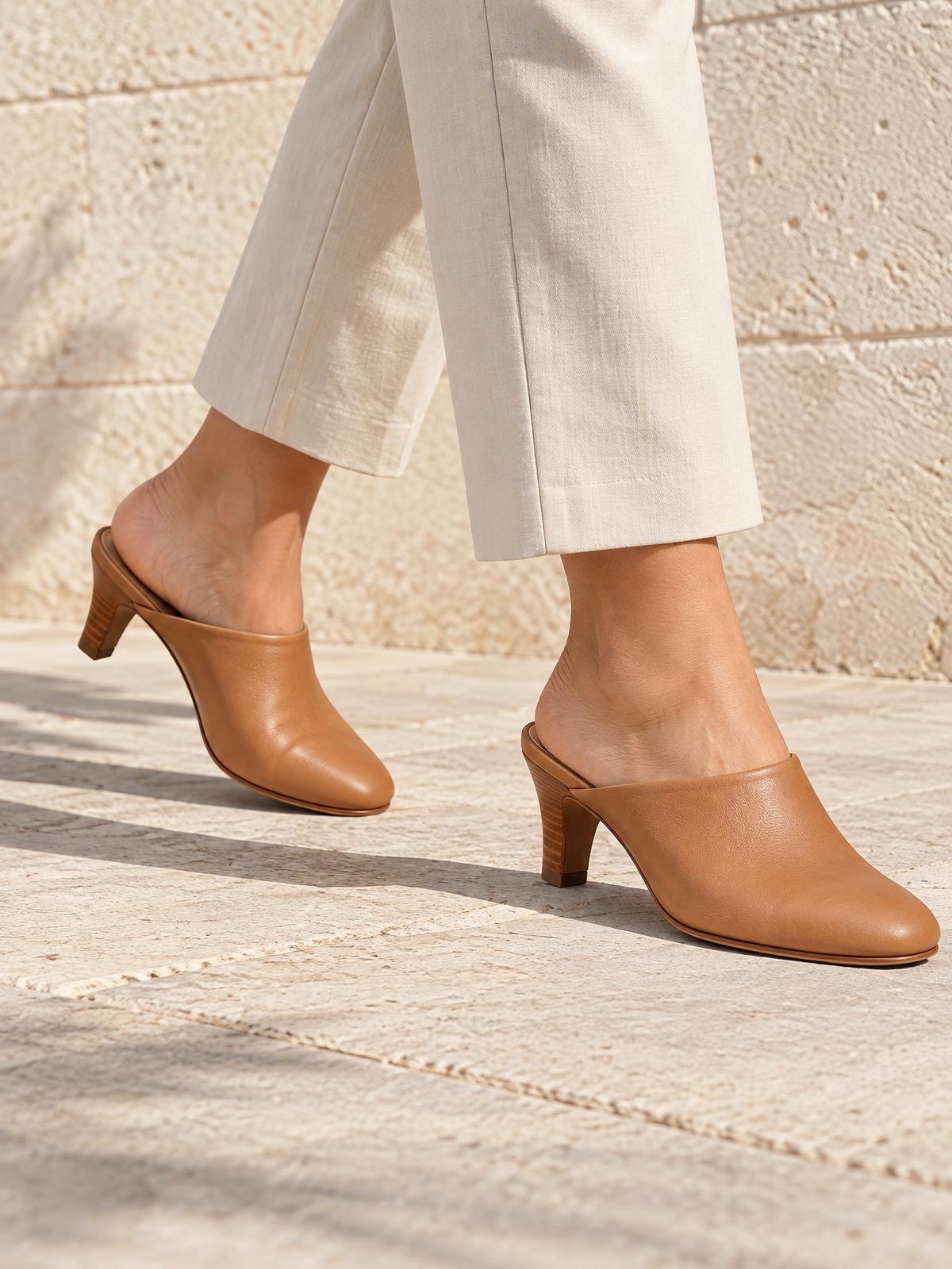 Kestrel Form Minimal Leather Mule in black — worn by a model