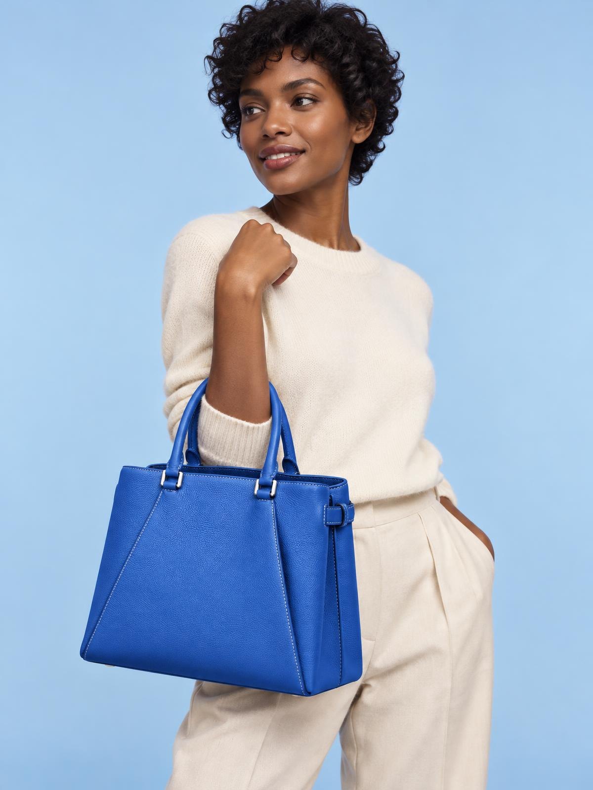 Objet Vide Folded Leather Tote in cobalt — worn by a model